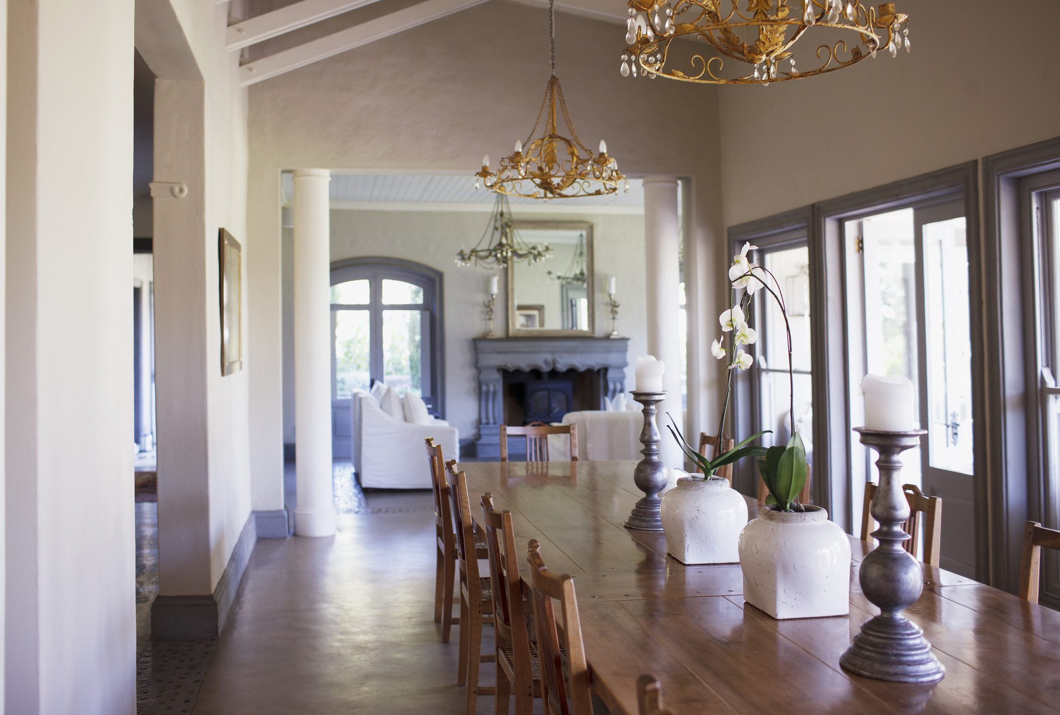 Sunlit dining room with long wooden table