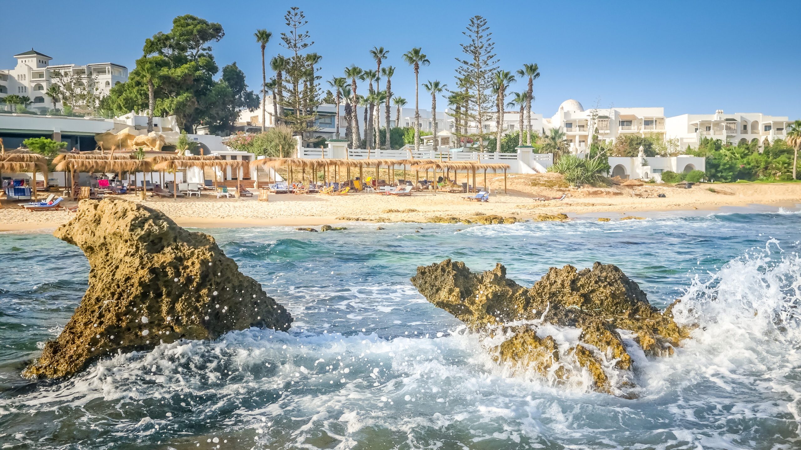 Beach resort with rocks and crashing waves