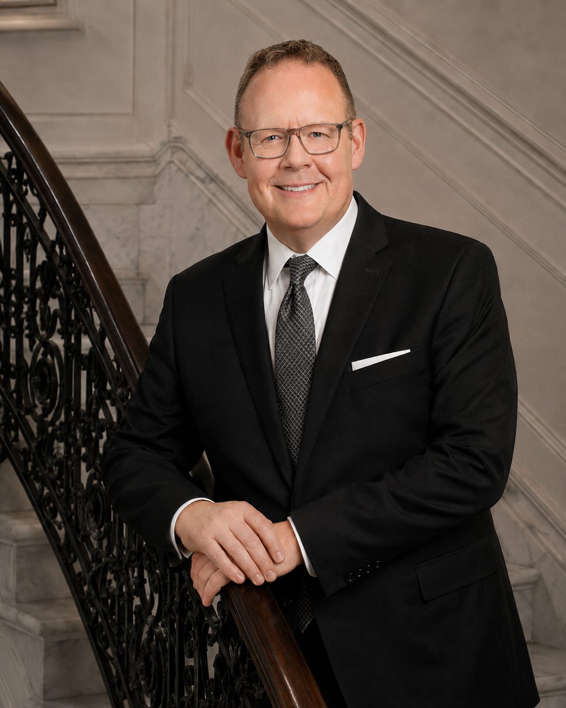 Smiling businessman in black suit